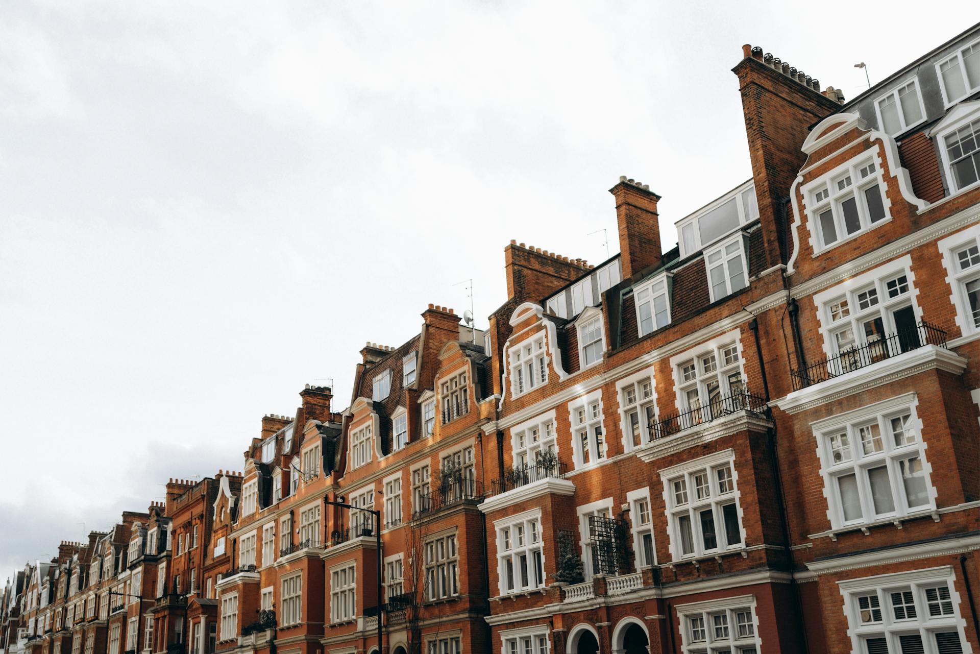 Pastel terraced townhouses in London's Notting Hill at dusk